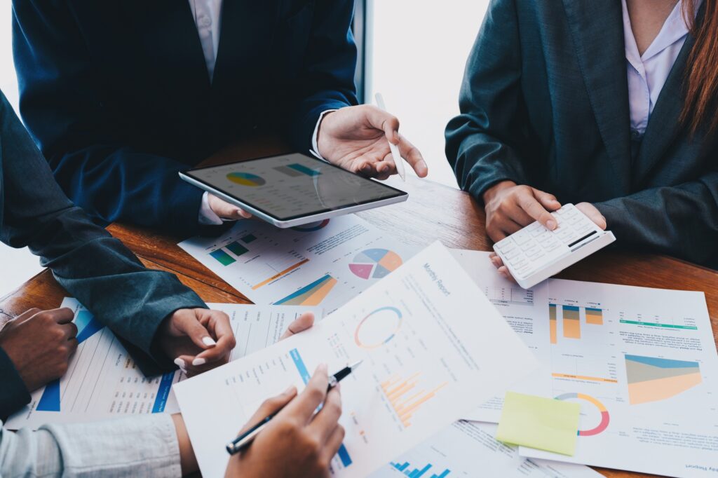 Business finance advisor investment consulting marketing plan for the company with using tablet and